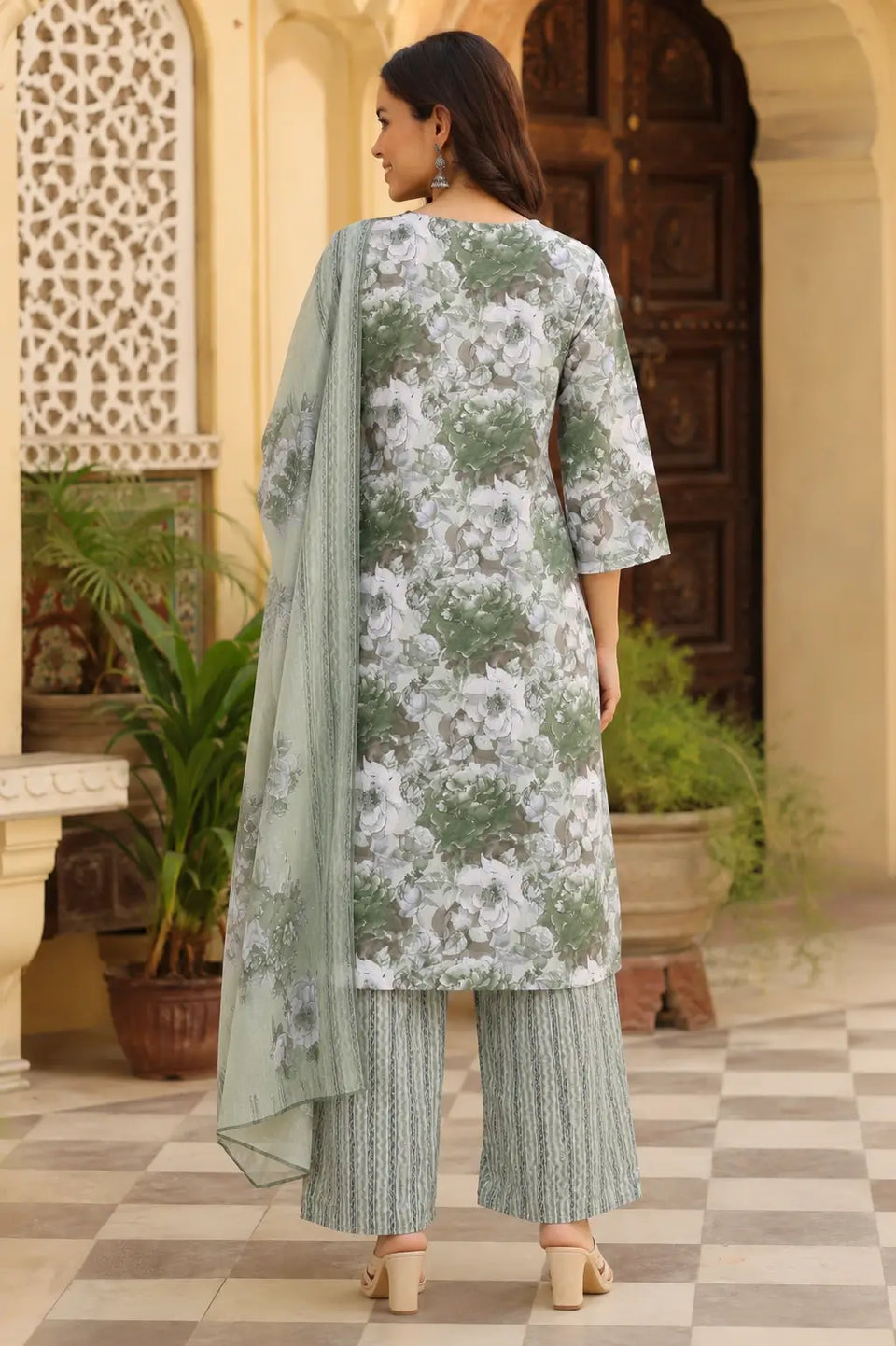 Back view of Rabric sage green cambric cotton floral kurta pant set with dupatta for women showing long kurta design and straight fit silhouette