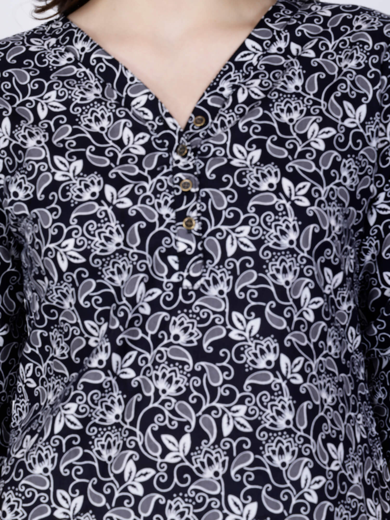 Close-up of V Neck Brass Button Detailing on Rabric Short Kurti