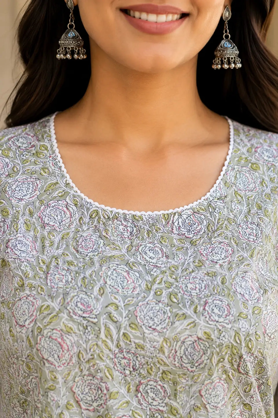 Close up of stylish round neck design on Rabric light green floral cotton kurti for women with soft breathable fabric