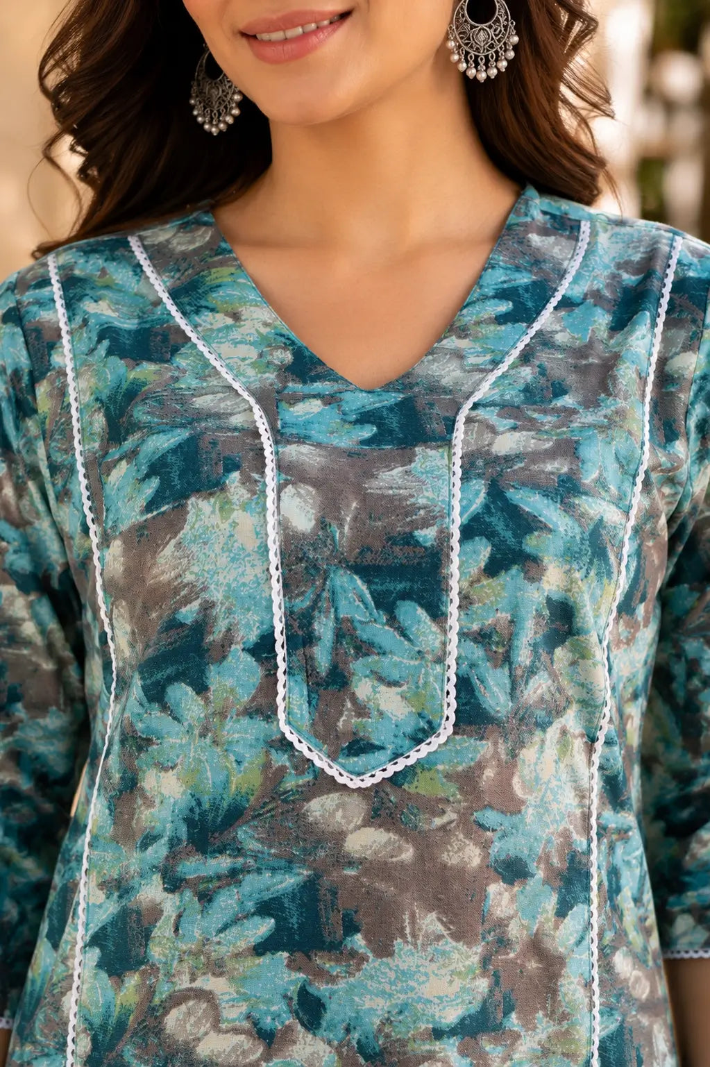 Close up neck design of Rabric women blue grey floral cotton kurti with stylish V neckline and lace detailing