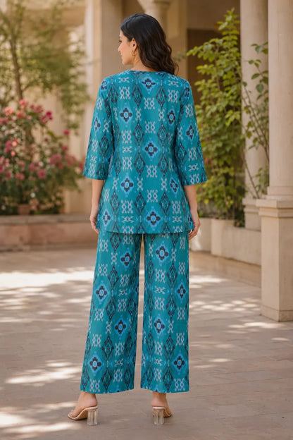 Rabric teal blue cotton ikat print co-ord set for women showing back view with relaxed kurti style top and matching printed pants