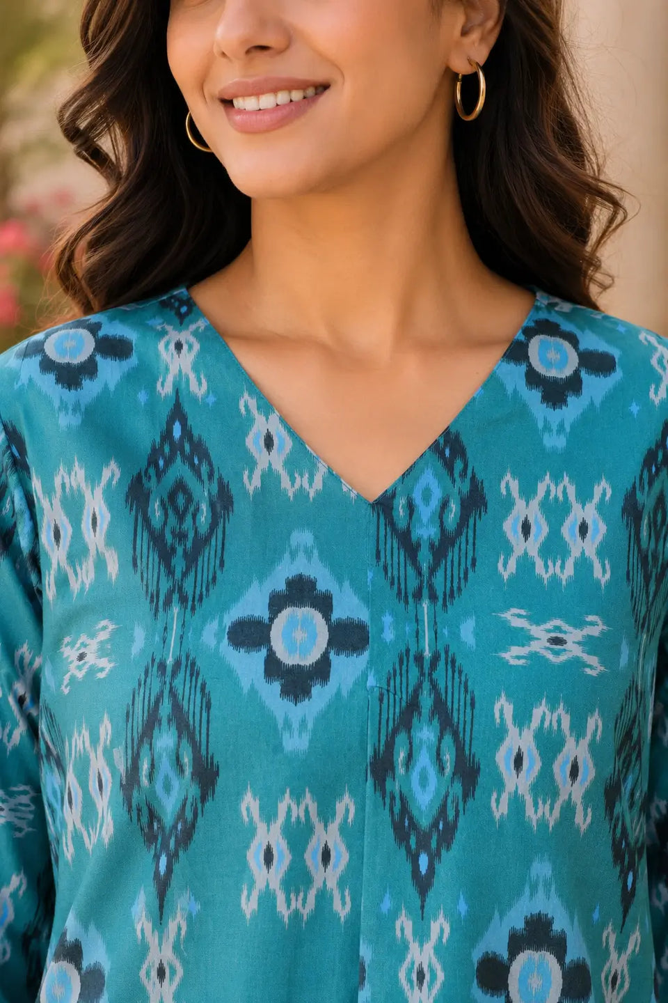 Close-up of Rabric teal cotton co-ord set V-neck design with ikat geometric and floral print for women