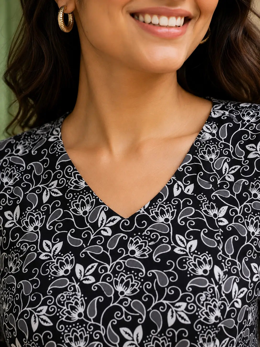 Closeup V neck design of Rabric black white cotton cambric floral short top for women premium casual wear