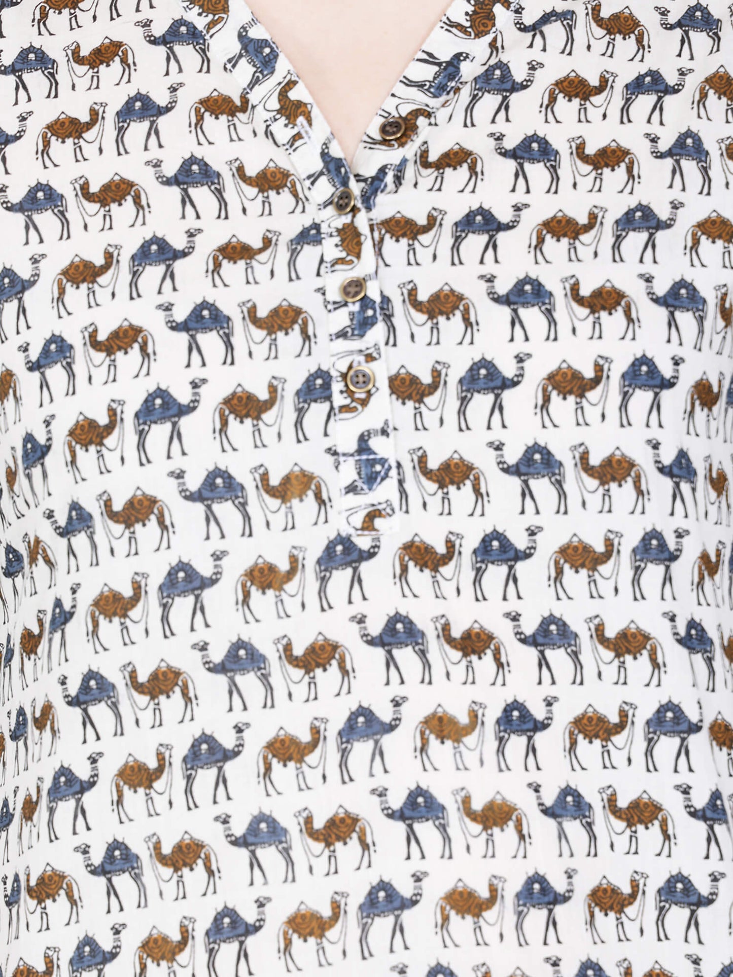 Closeup of V-neck brass buttons on cotton kurti