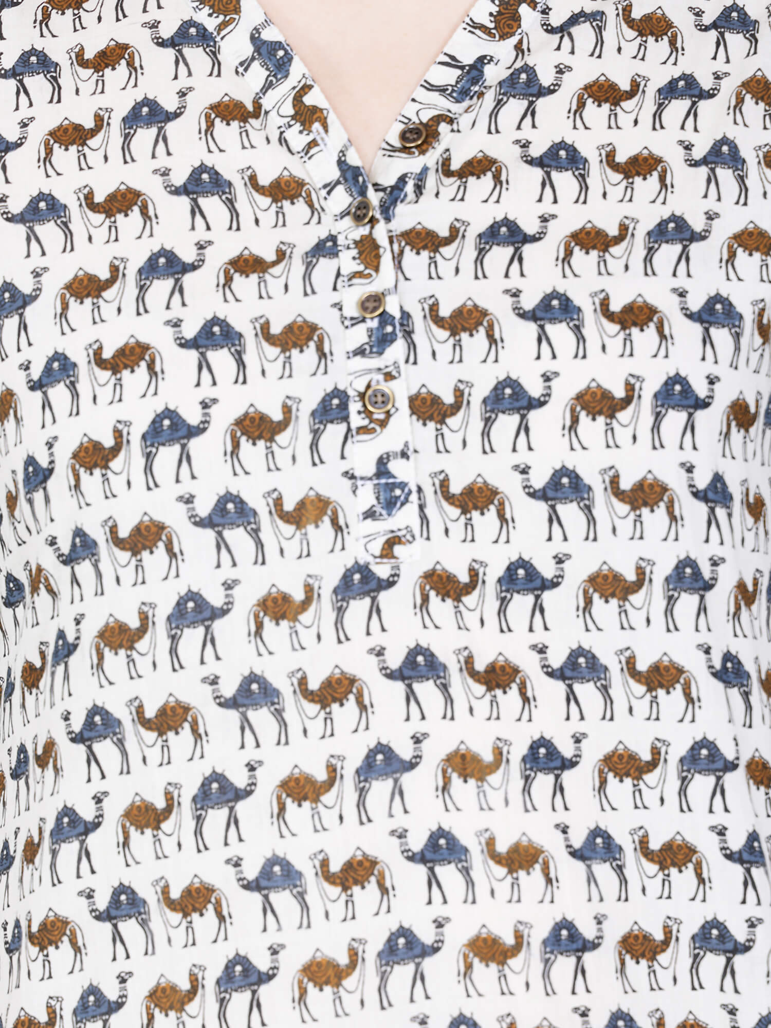 Closeup of V-neck brass buttons on cotton kurti