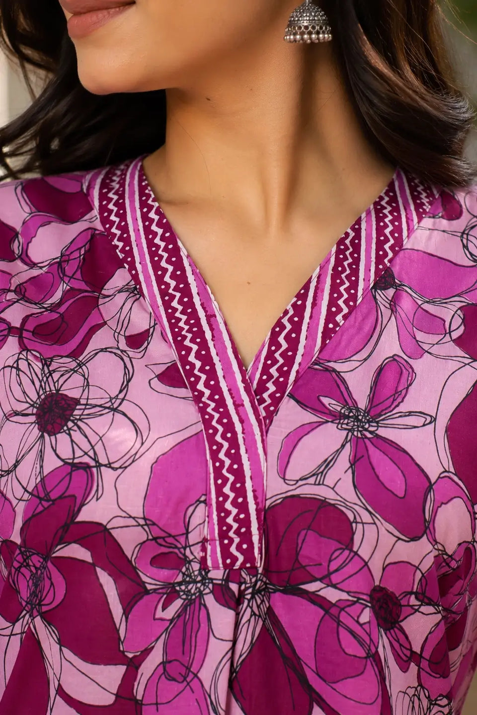 Close up V neck design on pink floral cotton kurta for women featuring stylish printed neckline detail by Rabric