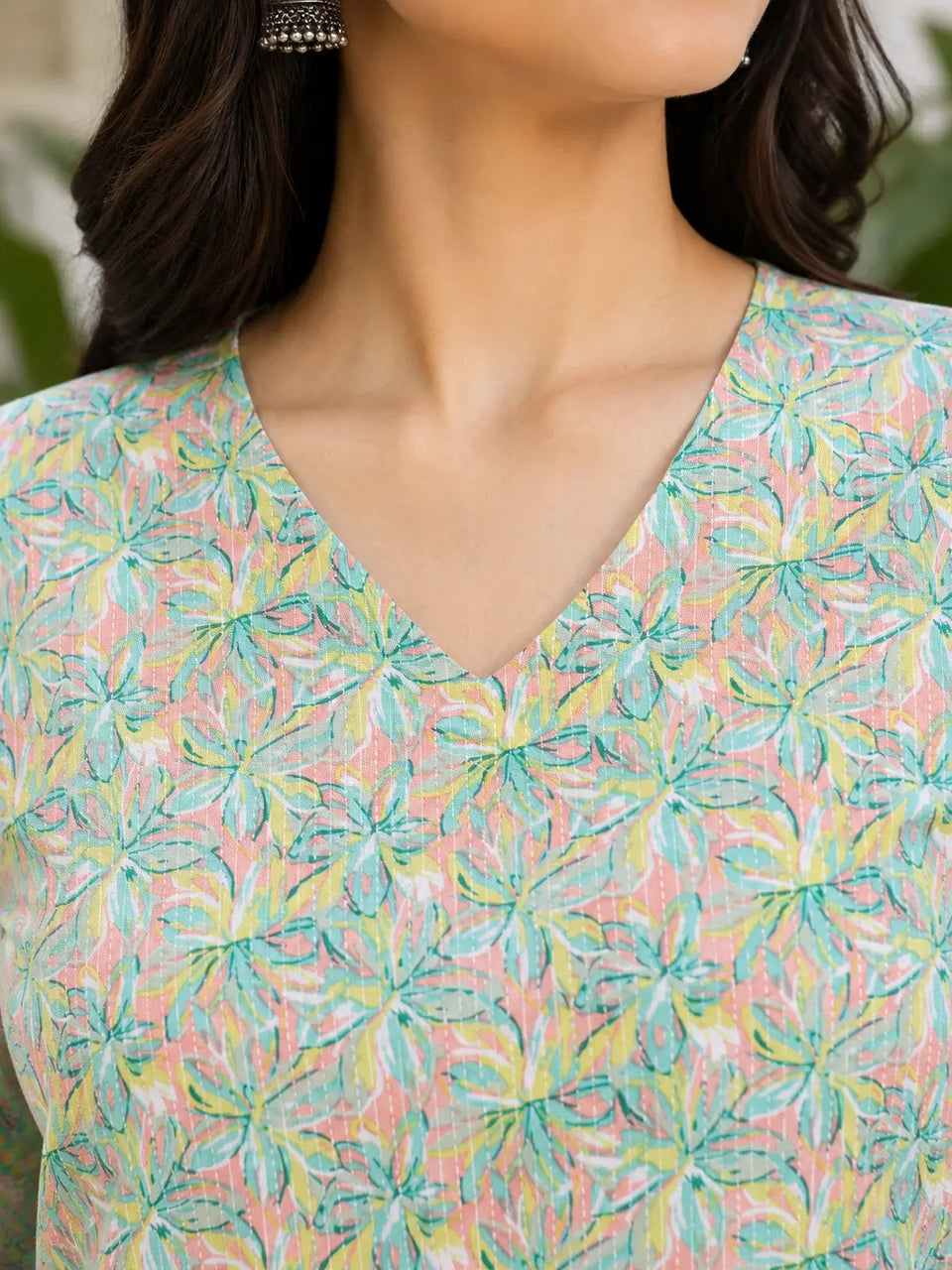 Close up of Rabric V neck pastel floral cotton short top neckline design for women casual summer wear