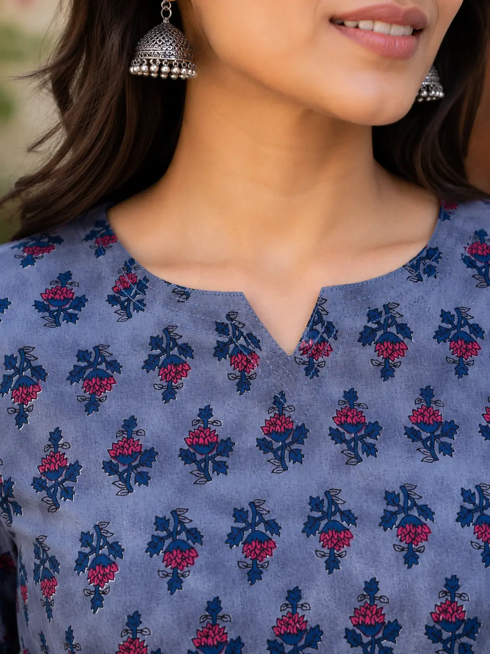 Close up V neck design of Rabric floral cotton short top for women with elegant ethnic neckline detailing