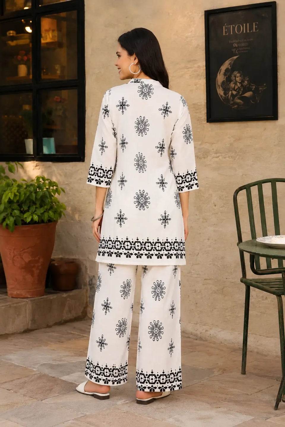 Back view of Rabric white black Vertican Silk ethnic printed co-ord set featuring 3-4 sleeves short kurti and matching printed pants