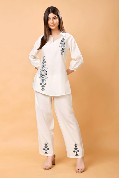 Model wearing Rabric white embroidered co-ord set in premium Vertican fabric