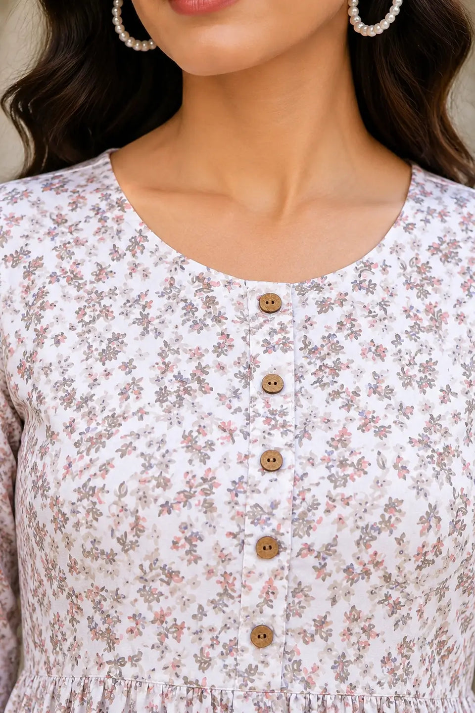 Closeup round neck design of Rabric white floral crepe women kurti with wooden button detailing