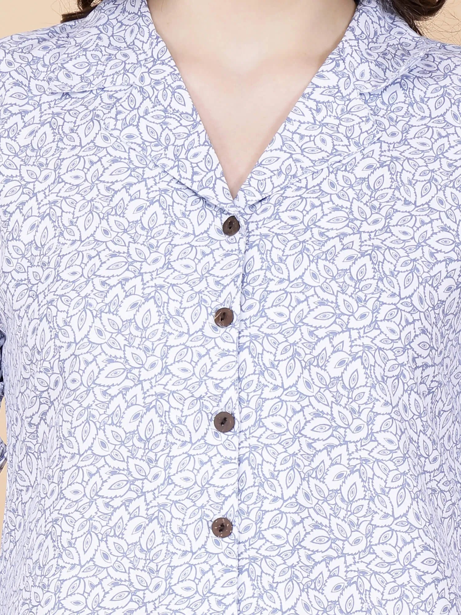 Close-up of glace cotton printed fabric and buttons