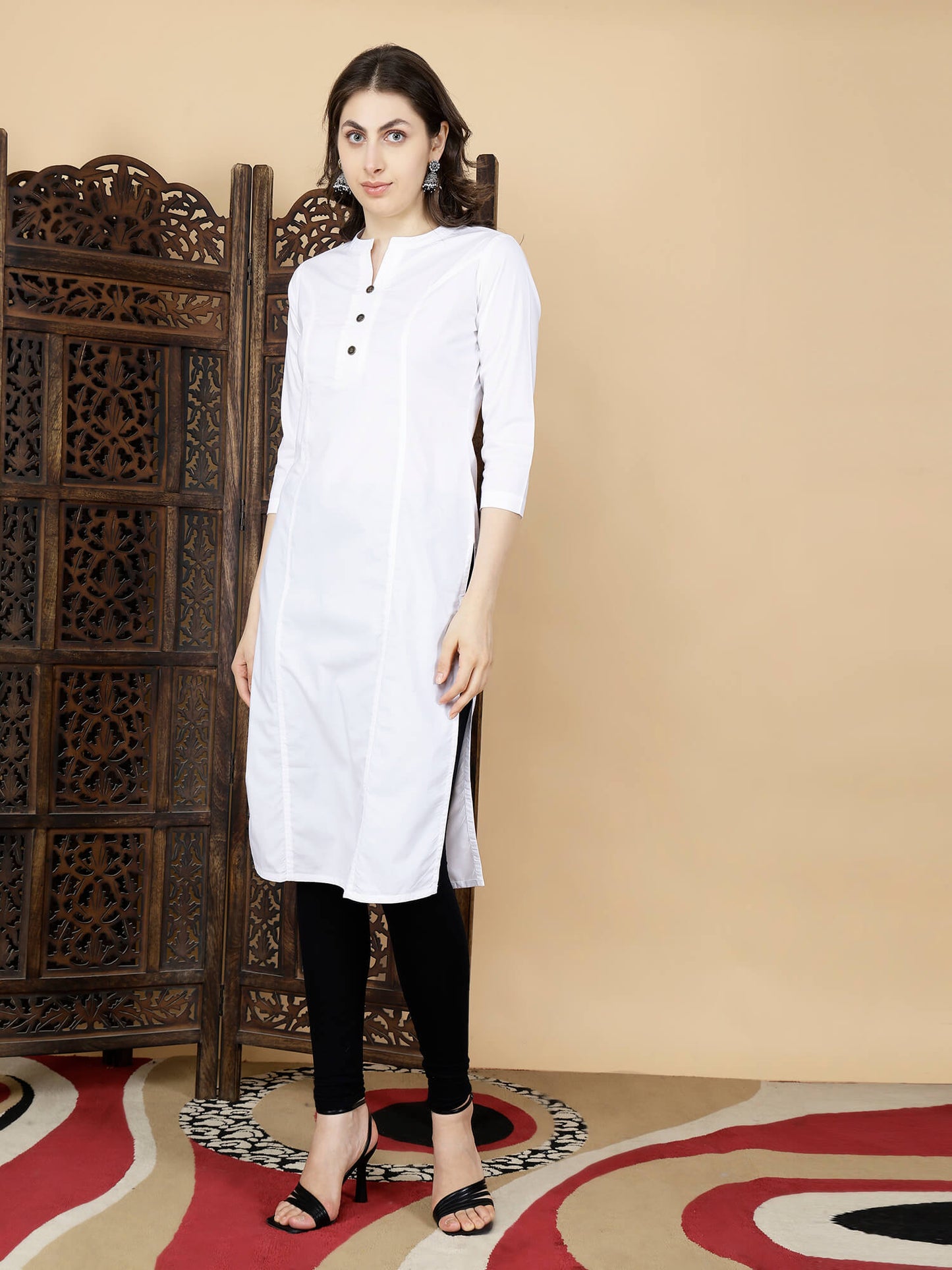 Model wearing Rabric white cotton long kurti with black leggings