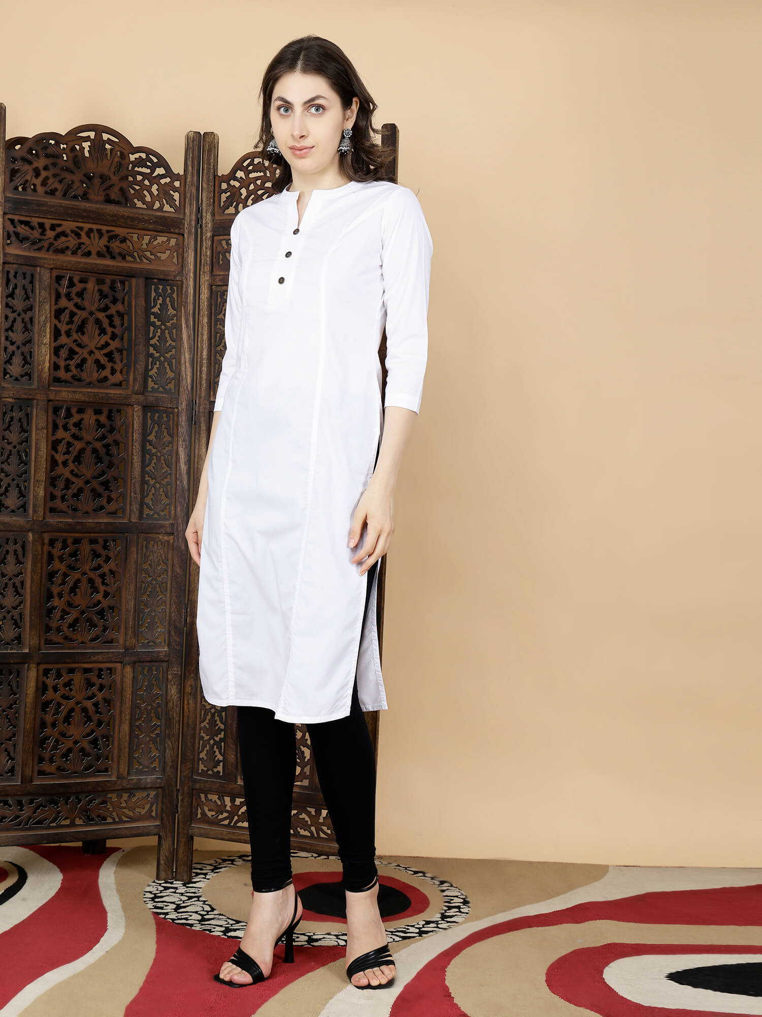 Model wearing Rabric white cotton long kurti with black leggings