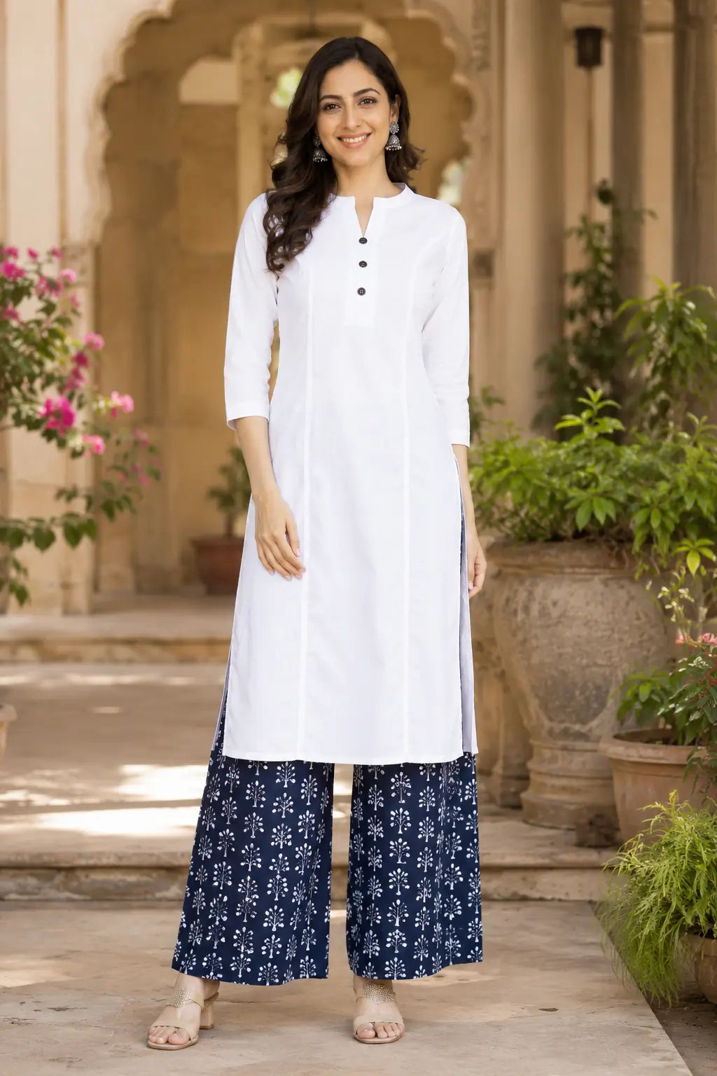 White popline cotton women kurti front view by Rabric featuring stylish neck design, 3/4 sleeves and straight fit ethnic wear