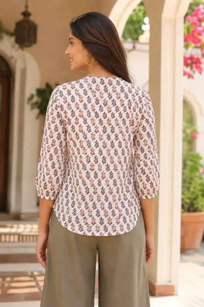 Back view of Rabric white floral printed cotton short top for women with relaxed fit and curved hem design