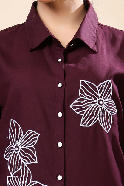 Close-up of white floral embroidery on Rabric wine co-ord set top and trouser