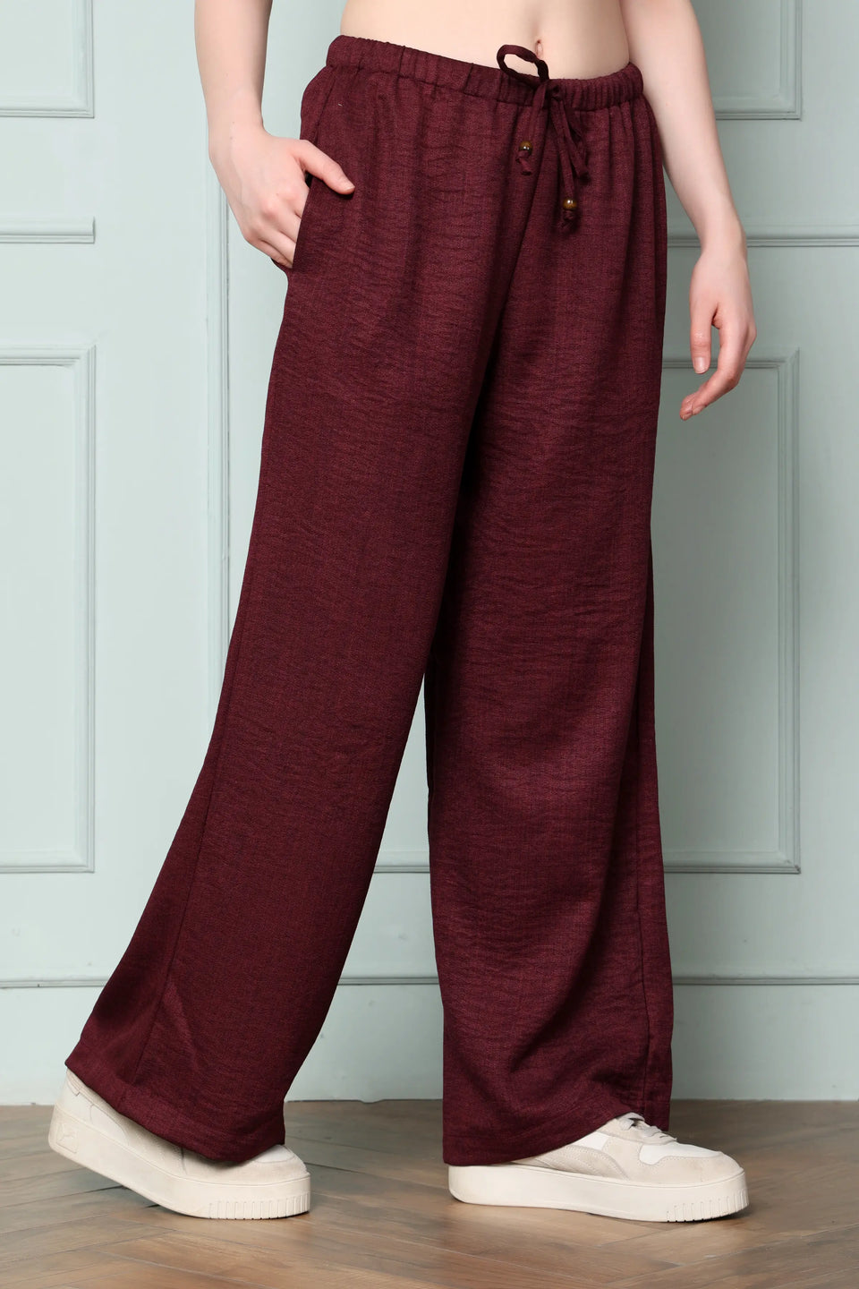 Side view of RABRIC wine linen wide leg pants for women showing relaxed full-length fit