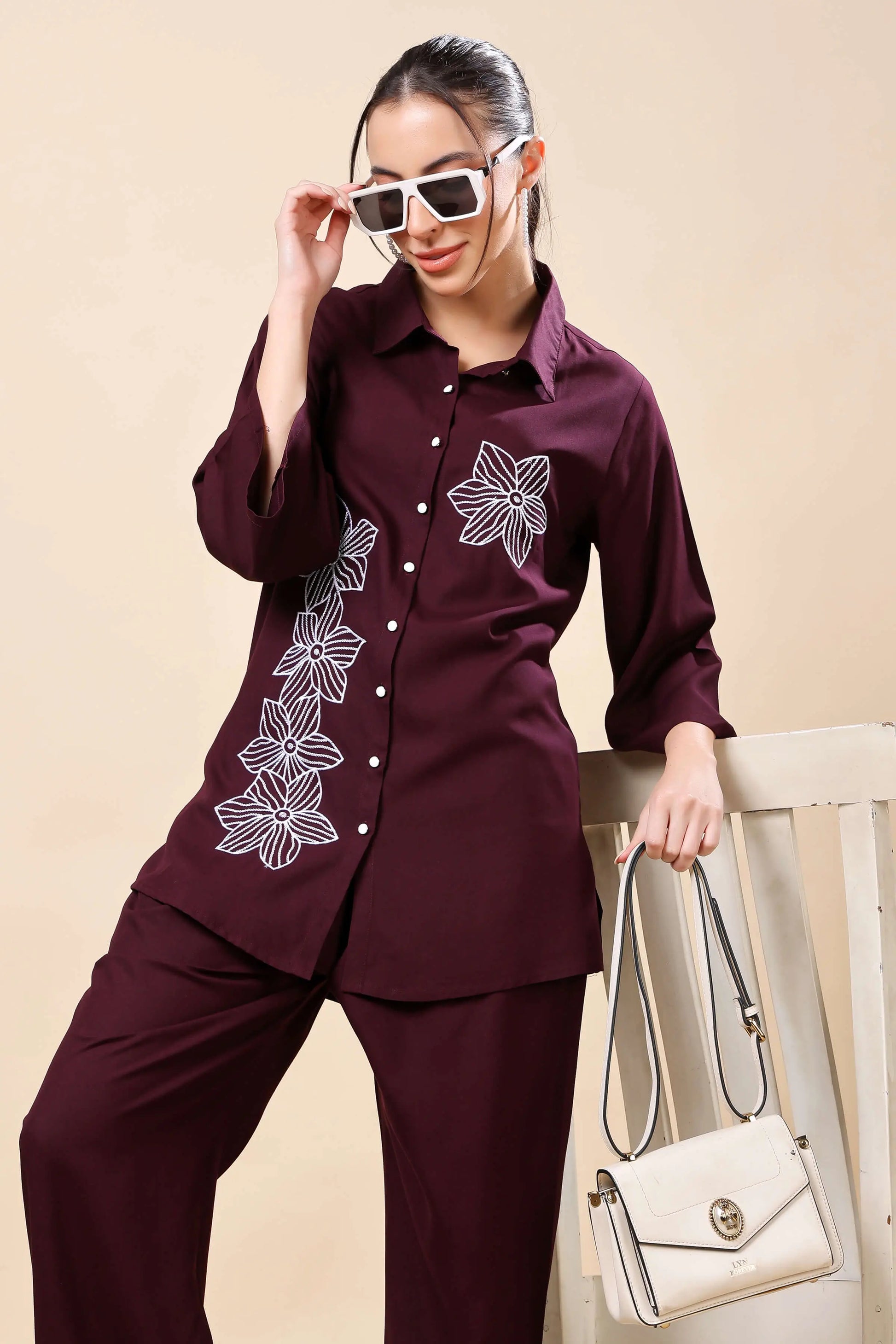 Flat lay of Rabric wine embroidered co-ord set with button-down top and trouser