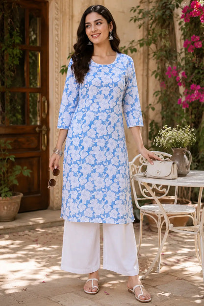 Woman wearing Rabric blue floral cotton kurti with white palazzo in casual lifestyle ethnic fashion look