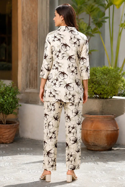 Back view of Rabric women cream rayon botanical floral printed co-ord set with straight pants and short shirt