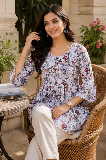 Lifestyle image of woman wearing floral cotton short top with casual accessories by Rabric