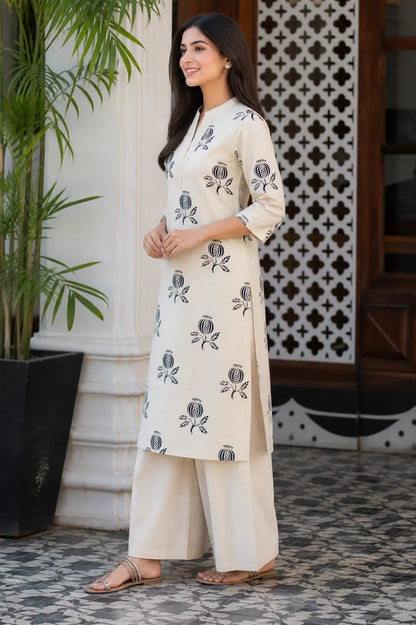 Side angle view of women’s beige cotton flex kurta pant set by Rabric