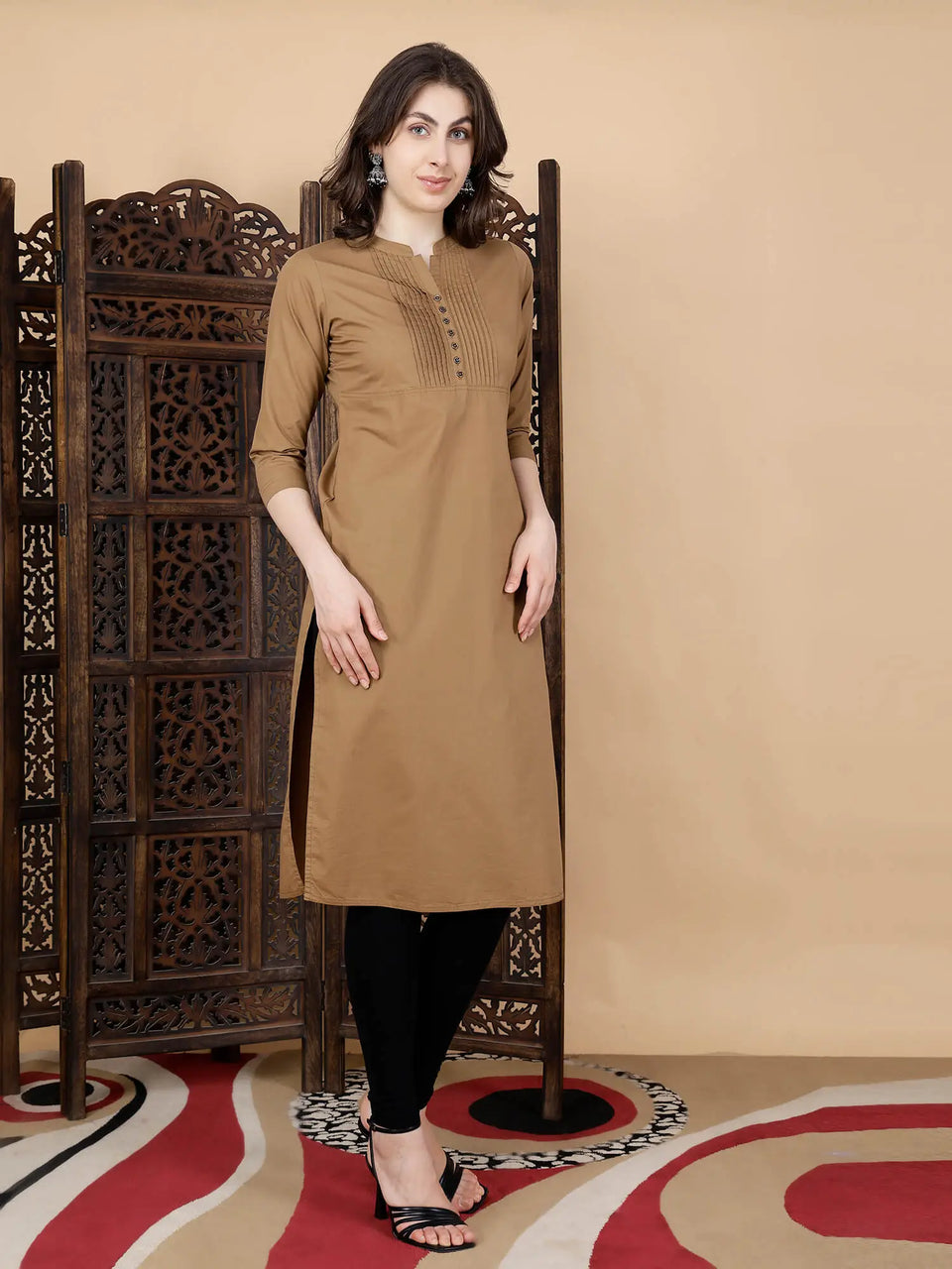 Women styling brown long kurti from Rabric with leggings