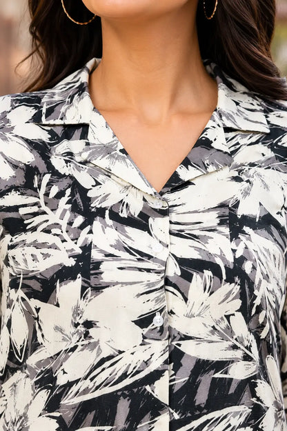 Closeup collar neck design of Rabric women floral printed rayon co-ord set in black and cream abstract leaf print