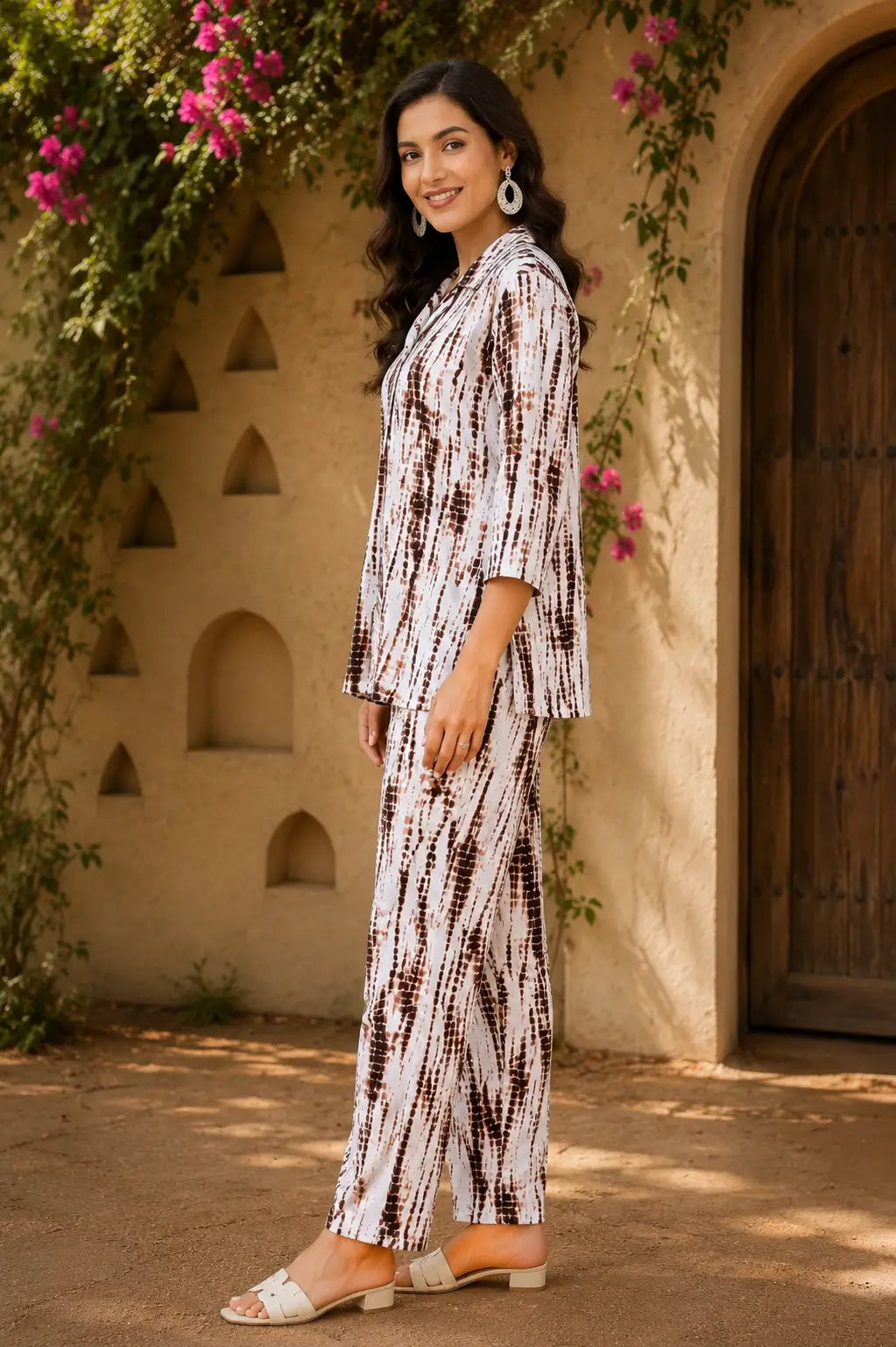 Side angle view of Rabric stylish rayon co-ord set for women in brown white abstract animal print with 3/4 sleeves