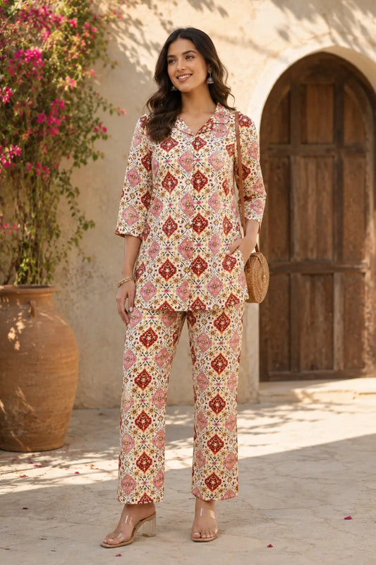 Stylish women outdoor lifestyle look wearing cream floral rayon co-ord set with relaxed straight pants by Rabric