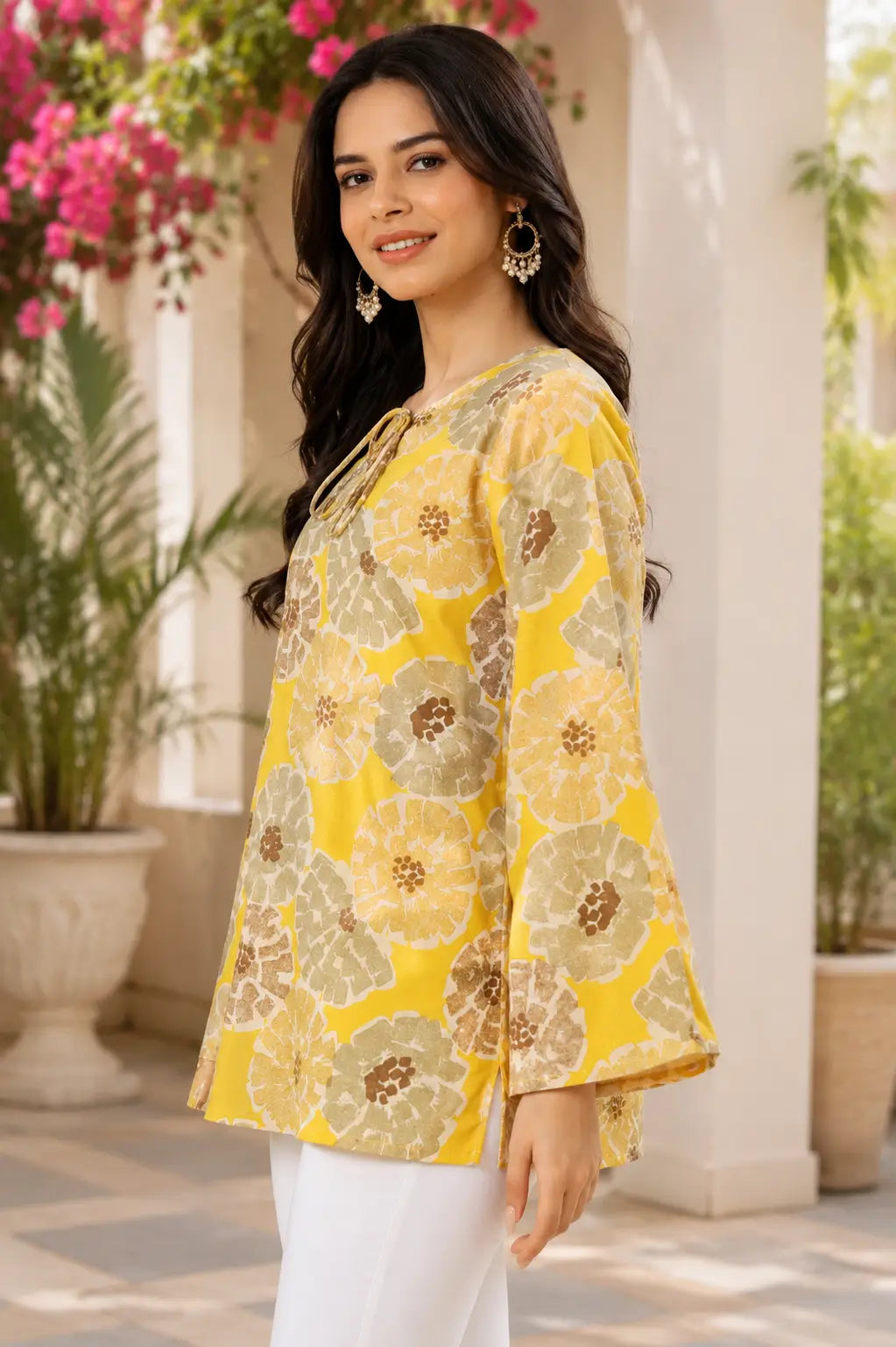Side view of RABRIC yellow floral bell sleeve top for women