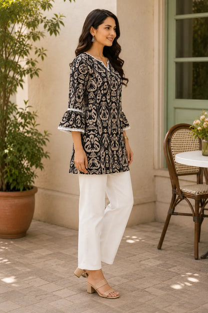 Side angle view of Rabric women cotton ethnic short kurta with bell sleeves and modern Indo western styling