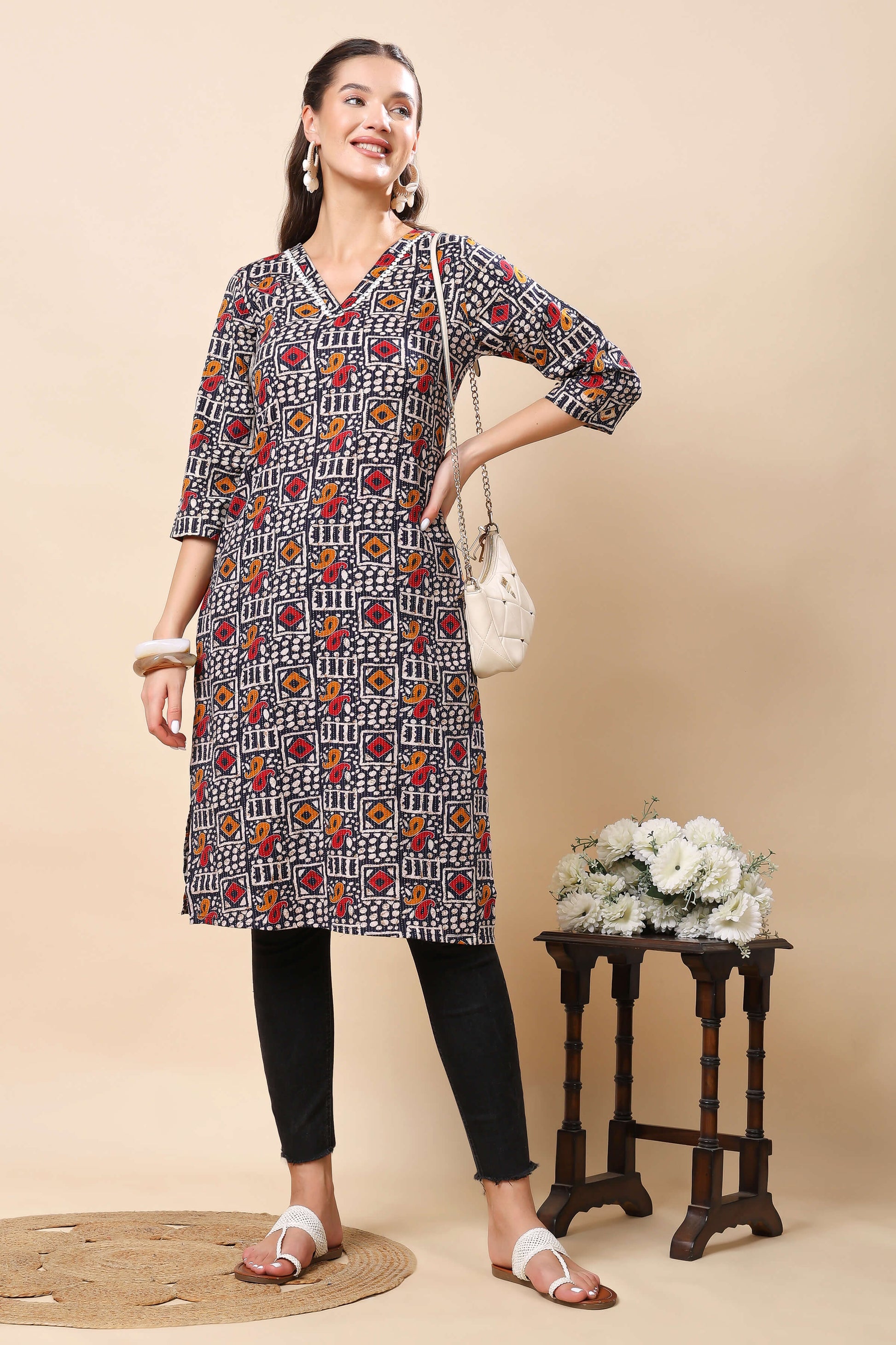 Elegant V-neck printed kurti in black with colorful motifs from Rabric