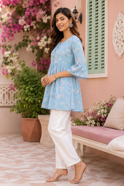 Side angle view of women floral cotton tunic top with flared fit and stylish bell sleeves