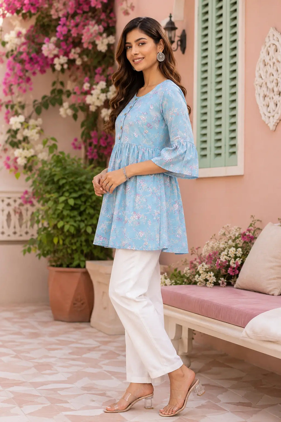 Side angle view of women floral cotton tunic top with flared fit and stylish bell sleeves