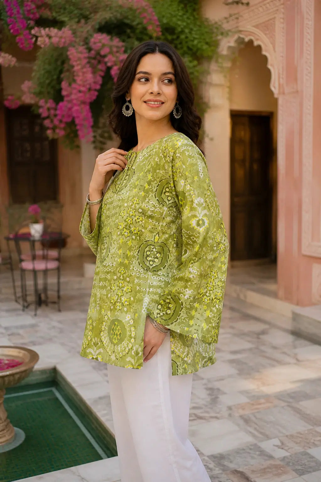 Side profile of RABRIC green casual kurta for women with stylish flared sleeves