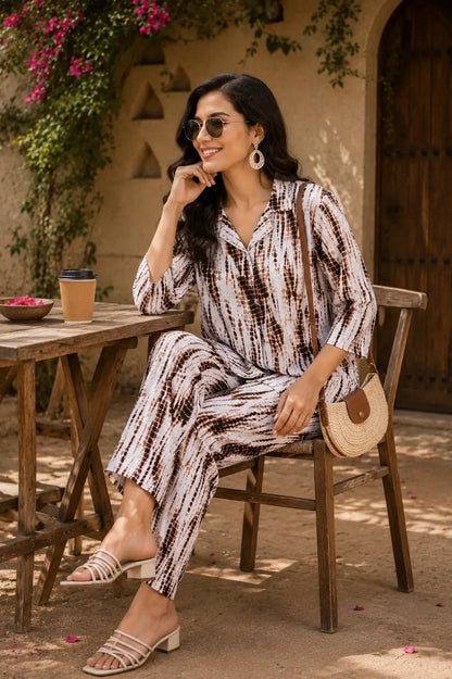 Rabric women rayon co-ord set in abstract brown white print shown in casual sitting pose with trendy accessories and summer styling