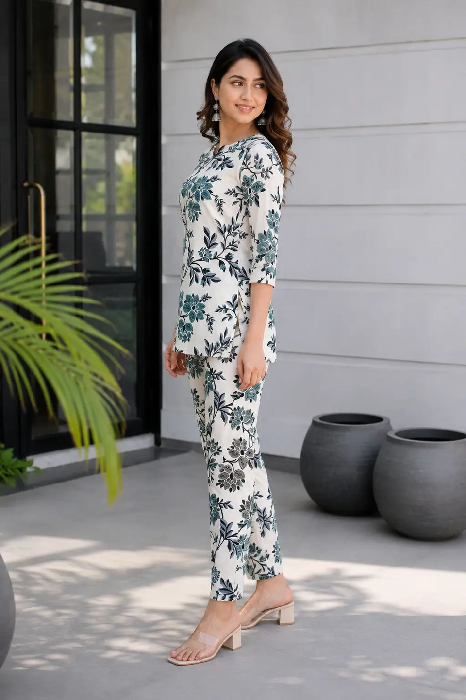 Side angle of women off white teal floral rayon co-ord set by Rabric stylish printed casual ethnic western coord outfit