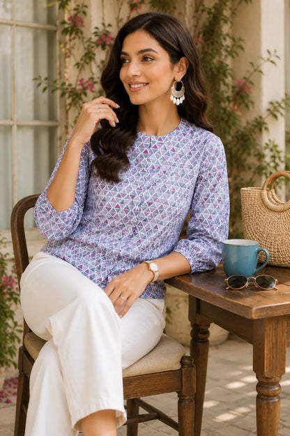 Women wearing Rabric white floral cotton short top in relaxed sitting pose with casual accessories and denim jeans