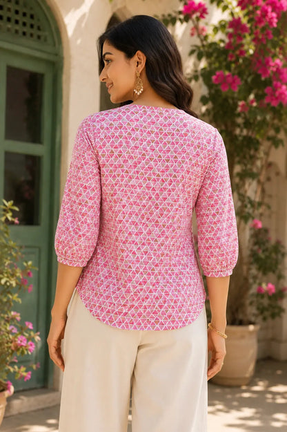 Back side view of Rabric yellow geometric print cotton short top for women with rounded hem and elastic 3/4 sleeves