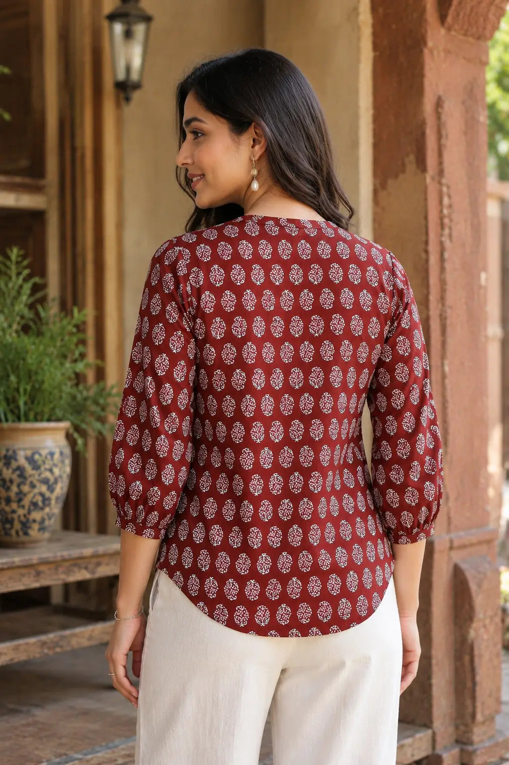 Back view of Rabric yellow cotton printed short top for women with 3-4 sleeves and shirt style design