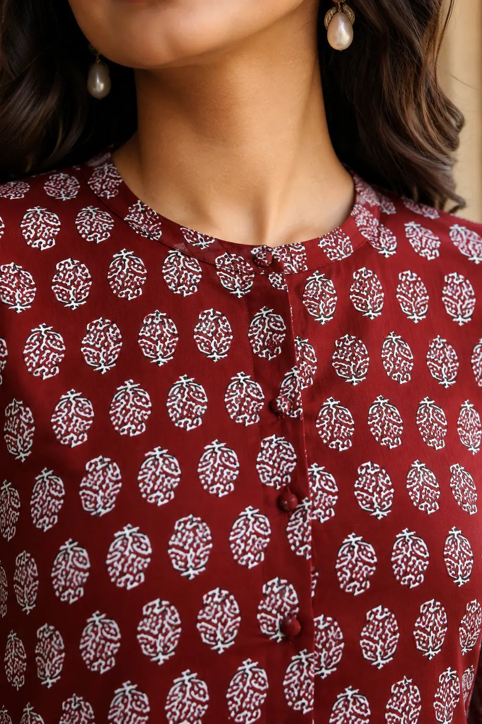 Close up neck design of Rabric yellow cotton printed women short top with front button openable style