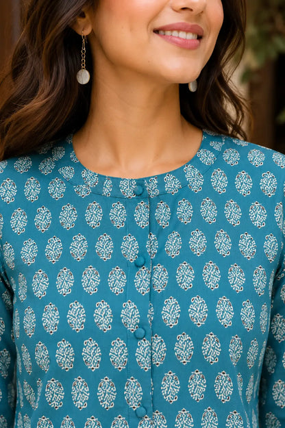 Close up of round neck and front button detailing on Rabric yellow cotton printed women short top