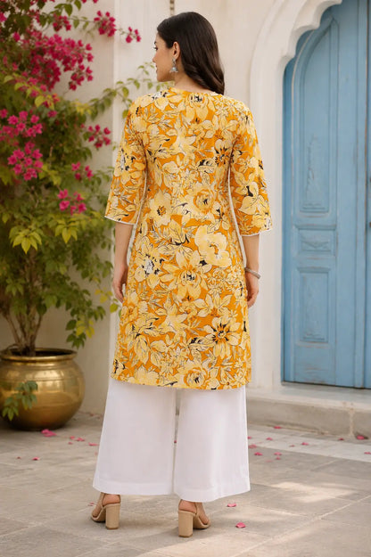 Back view of Rabric yellow floral cotton kurti for women featuring comfortable mid length fit and 3/4 sleeves ethnic wear