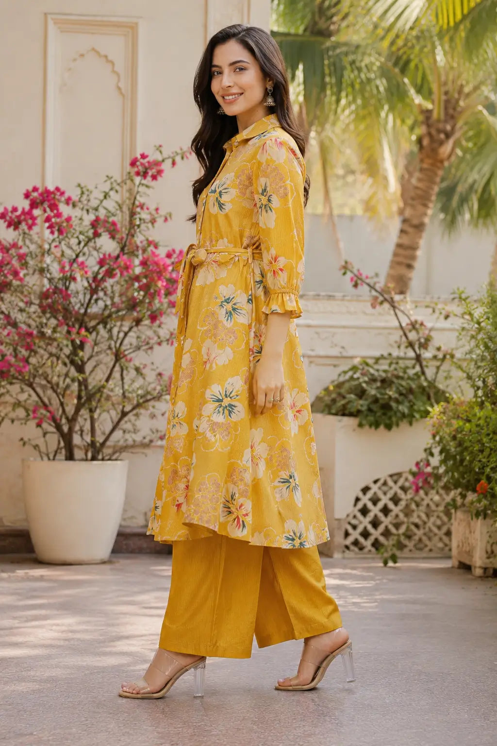Side angle view of Rabric mustard yellow floral vertical silk kurta and palazzo set