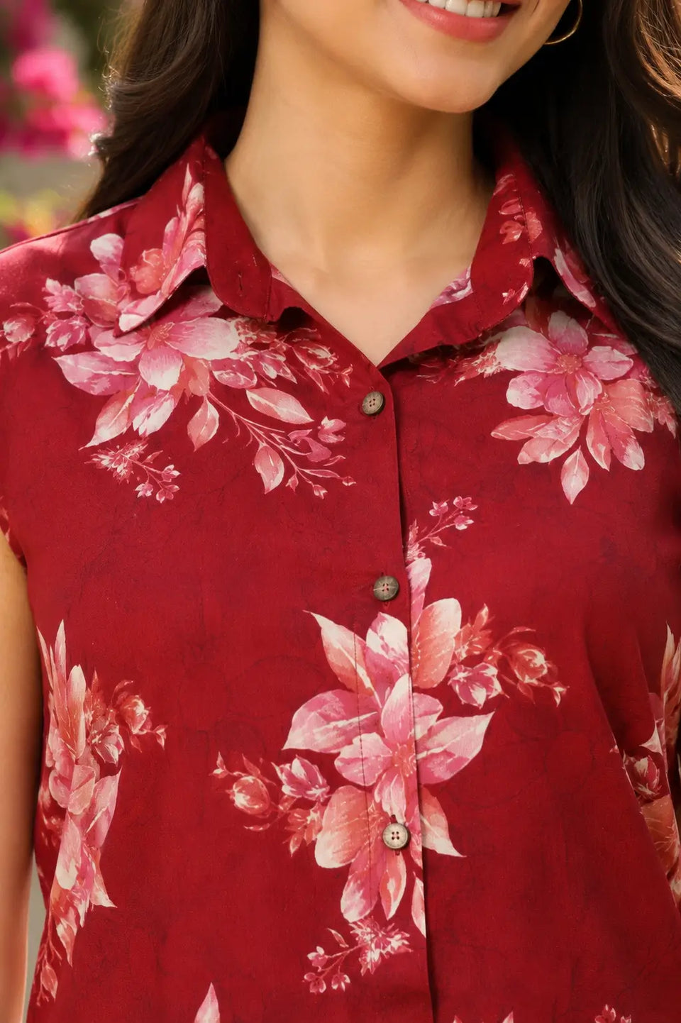 Close-up of red floral co-ord set collared neck and button detail