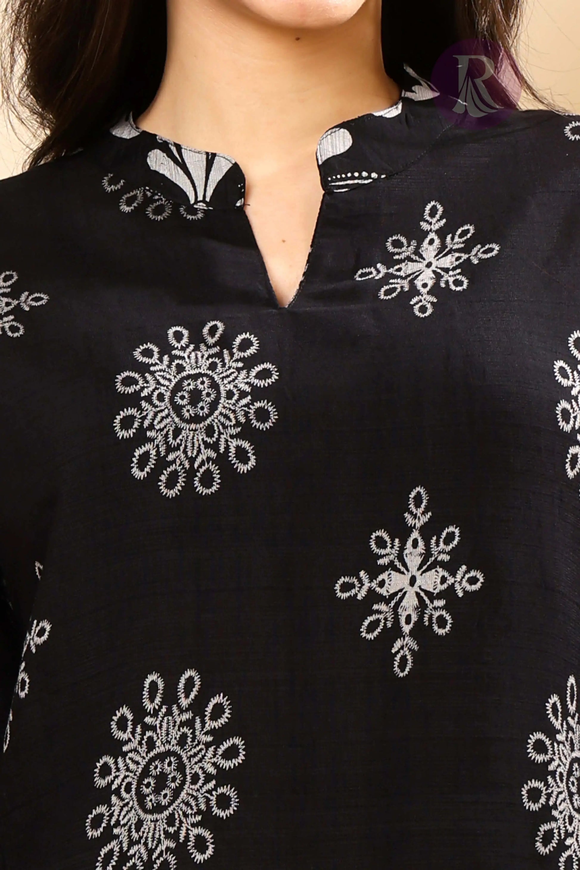 Close-up of soft Vertican Silk fabric with ethnic print detailing
