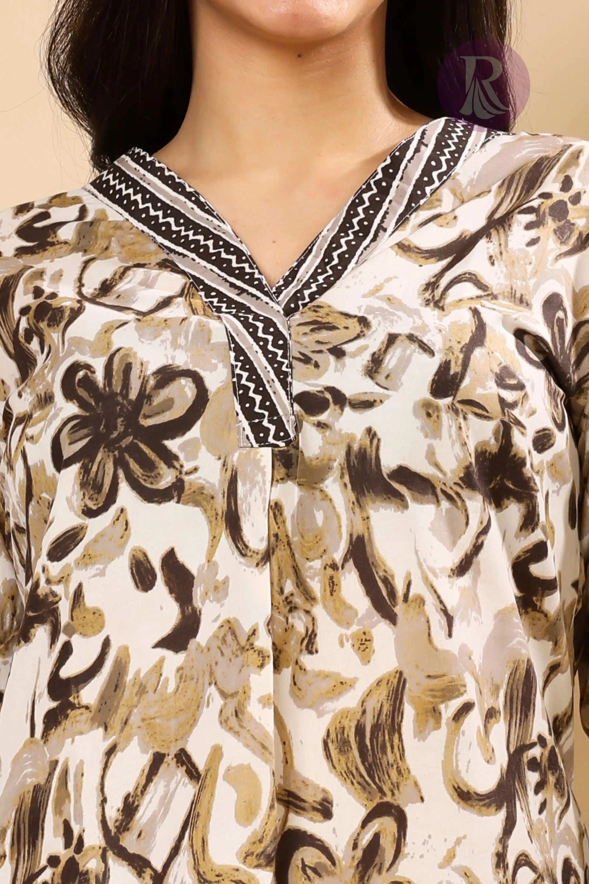Close-up of V-neck kurta with thread work design in cotton slub fabric for women