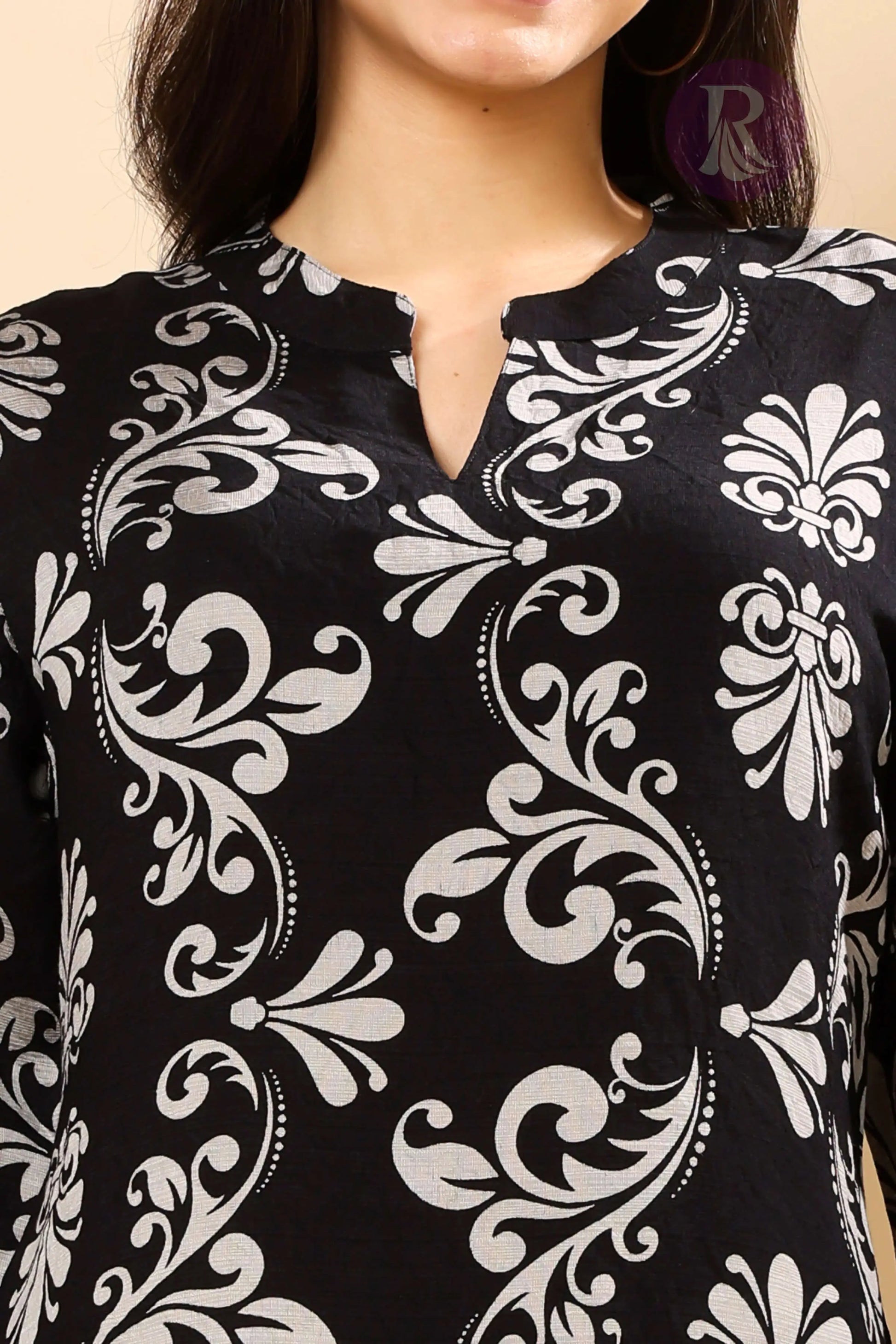 Close-up of vertican silk fabric and silver floral print in Rabric co-ord set